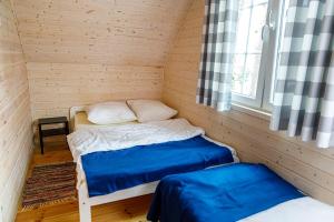 Postel nebo postele na pokoji v ubytování Pinia
