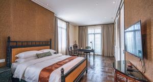 TV a/nebo společenská místnost v ubytování Guangzhou Nansha Stone Inn