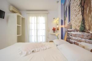 Ένα ή περισσότερα κρεβάτια σε δωμάτιο στο simos luxury apartments