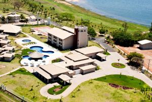 an aerial view of a resort with a pool and a building at Resort da Ilha in Sales
