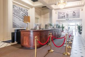 a courtroom with a red ribbon in a building at Thermae Palace in Ostend
