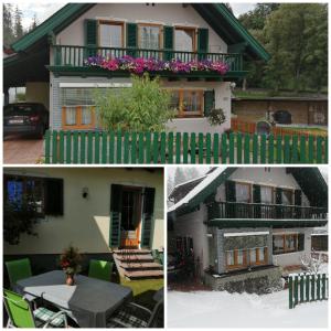 毛特恩多夫的住宿－Ferienwohnung Schreilechner，一座房子,前面有绿色的围栏和桌子