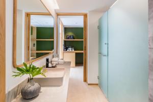 a bathroom with a sink and a mirror at La Vida Samui in Chaweng