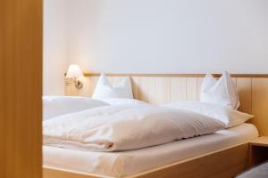 Posteľ alebo postele v izbe v ubytovaní Haus Braunarl