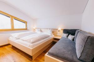 Posteľ alebo postele v izbe v ubytovaní Haus Braunarl