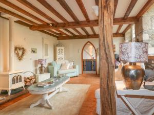 a living room with a table and a couch at Coinage Hall in Lostwithiel