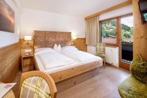Posteľ alebo postele v izbe v ubytovaní Hotel Platzl