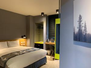 Voodi või voodid majutusasutuse Raise Hotel Taichung toas