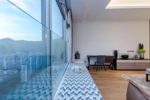 a living room with a view of a city at The Clouds Apartment in Shenzhen