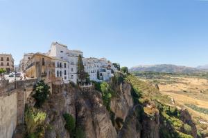 a village on the side of a mountain at Apartamento Sofia Ronda Center in Ronda