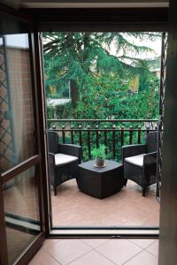 a view of a patio with chairs and a table at Villa Mercedes in Rome