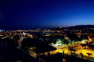 a view of a city at night with lights at Hotel Saratoga in Palma de Mallorca