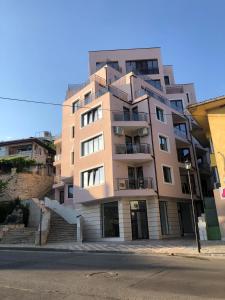 a tall building on a city street with at D'arte Studio in Balchik