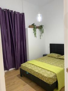 A bed or beds in a room at Aluche Aparment A