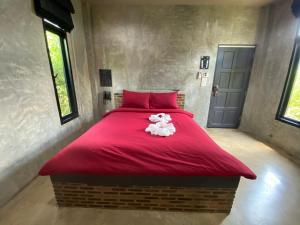 The Loft House Sakaeo客房内的一张或多张床位