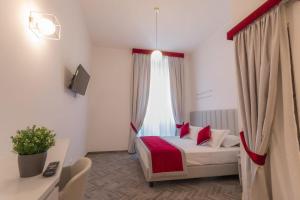 Posteľ alebo postele v izbe v ubytovaní Frattina FF italian suites