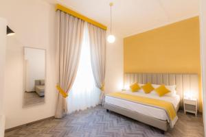 Posteľ alebo postele v izbe v ubytovaní Frattina FF italian suites