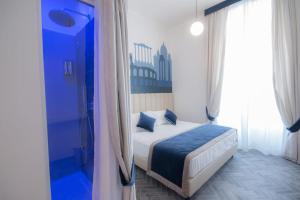 Posteľ alebo postele v izbe v ubytovaní Frattina FF italian suites