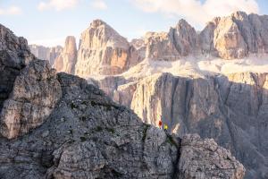 two people standing on the edge of a mountain at Hotel Des Alpes in La Villa