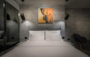 Postel nebo postele na pokoji v ubytování Level Luxury Suites