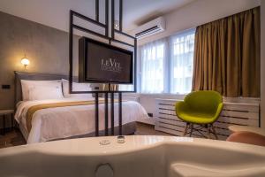 Postel nebo postele na pokoji v ubytování Level Luxury Suites