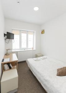 Postel nebo postele na pokoji v ubytování Happy Inn