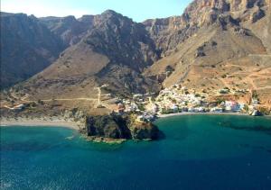 an aerial view of a beach on a mountain at Wooden House at the Mountain-private in Paránimfoi