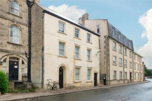 a building with a bike parked in front of it at The Courtyard Cirencester in Cirencester