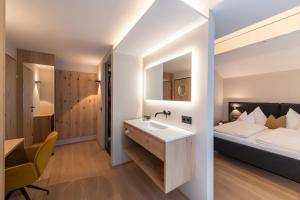 Voodi või voodid majutusasutuse Hotel Bradabella - Montafon toas