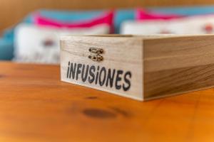 a wooden box with the word missionaries sitting on a table at Casita Collado 3 in Alájar