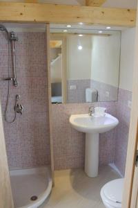 a bathroom with a sink and a shower and a toilet at Casa Vacanza al Mare Villa Adriana in Granelli