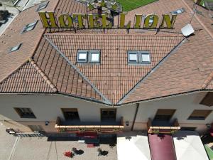 an overhead view of a building with a sign on it at Hotel Lion in Roure Turin +15 photos