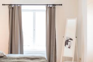 Posteľ alebo postele v izbe v ubytovaní Cozy Kunsthaus GRAZ