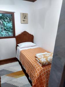 Tempat tidur dalam kamar di Sítio Canto das Águas