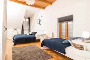 Posteľ alebo postele v izbe v ubytovaní Cozy Kunsthaus GRAZ