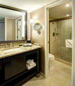a bathroom with a sink and a toilet and a shower at InterContinental New Orleans, an IHG Hotel in New Orleans