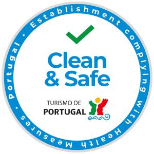 a blue clean and safe logo at Residencial Familia in Machico