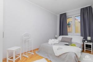 Posteľ alebo postele v izbe v ubytovaní Apartament Gryf w sercu Szczecina-SANNEL Apartments for rent
