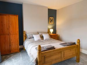a bedroom with a bed with two pillows on it at Stang View in Barnard Castle
