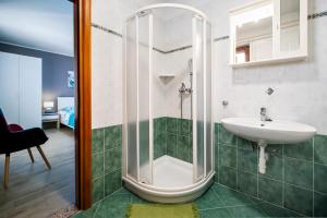 a bathroom with a shower and a sink at Casa Leona in Rovinj