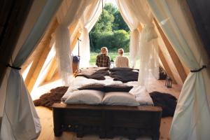 Voodi või voodid majutusasutuse Sandfallet Glamping toas