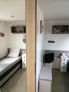 Posteľ alebo postele v izbe v ubytovaní Mobil home La Mer