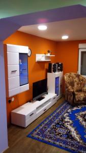 a living room with a tv and a couch at Maja in Velika Gorica