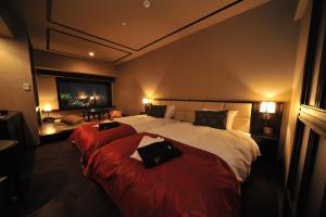 
a hotel room with a bed and a desk at La Vista Hakodate Bay in Hakodate
