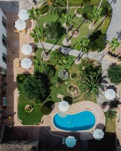 an overhead view of a garden with a swimming pool at Curolla Petit Hotel in Maria de la Salut