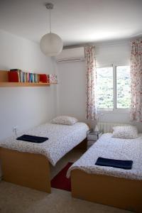 Katil atau katil-katil dalam bilik di Guejar Sierra House with Spectacular Views