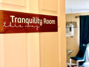 a sign that reads tranquility room the way at Evergreen Bed & Breakfast in Hope