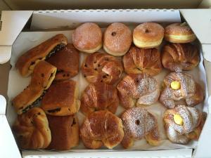 a box filled with lots of different types of pastries at C'era una volta in Terracina