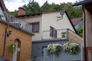 a house with balconies on the side of it at FERIENWOHNUNG im Dornröschendorf in Dörrenbach