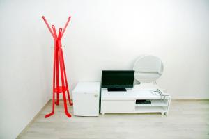 a room with a white desk with a red pole at Ari House in Seoul